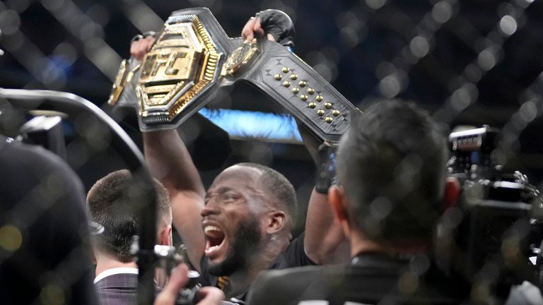 UFC fighter Leon Edwards, celebrates his title as welterweight champion of the world after knocking out Nigerian UFC fighter Kamaru Usman during the UFC 278 mixed martial arts title bout in Salt Lake City on Saturday, Aug. 20, 2022. (Francisco Kjolseth/The Salt Lake Tribune via AP)