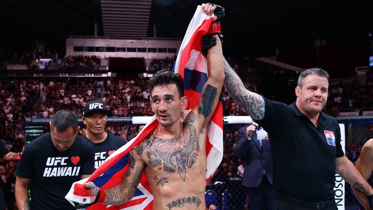 Max Holloway celebrates his knockout victory over Chan Sung Jung 