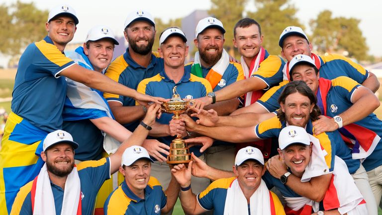 Europe&#39;s Team Captain Luke Donald , centre, and team members lift the Ryder Cup after winning the trophy by defeating the United States 16/12 point to 11 1/2 points at the Marco Simone Golf Club in Guidonia Montecelio, Italy, Sunday, Oct. 1, 2023. (AP Photo/Alessandra Tarantino)