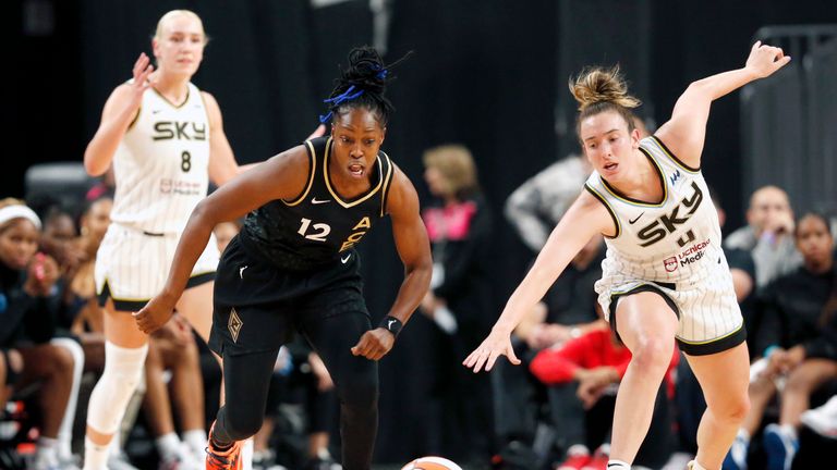 Las Vegas Aces guard Chelsea Gray (12) and Chicago Sky guard Marina Mabrey (4) chase the ball during the first half of Game 1 in a first-round WNBA basketball playoff series Wednesday, Sept. 13, 2023, in Las Vegas. Sky forward Alanna Smith is at left. (Steve Marcus/Las Vegas Sun via AP)